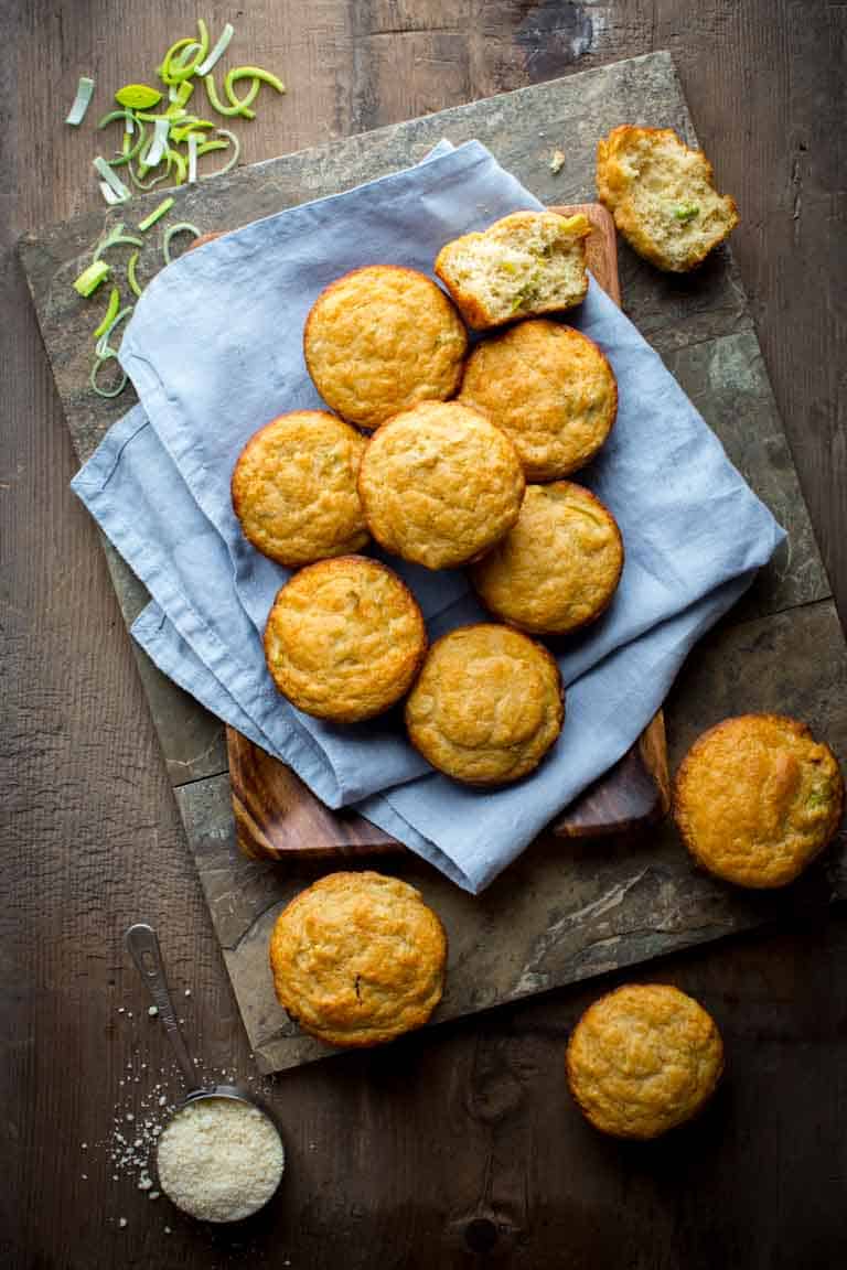 a blue napkin with parmesan muffins on top