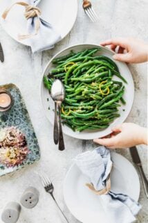 a platter of green beans on a table