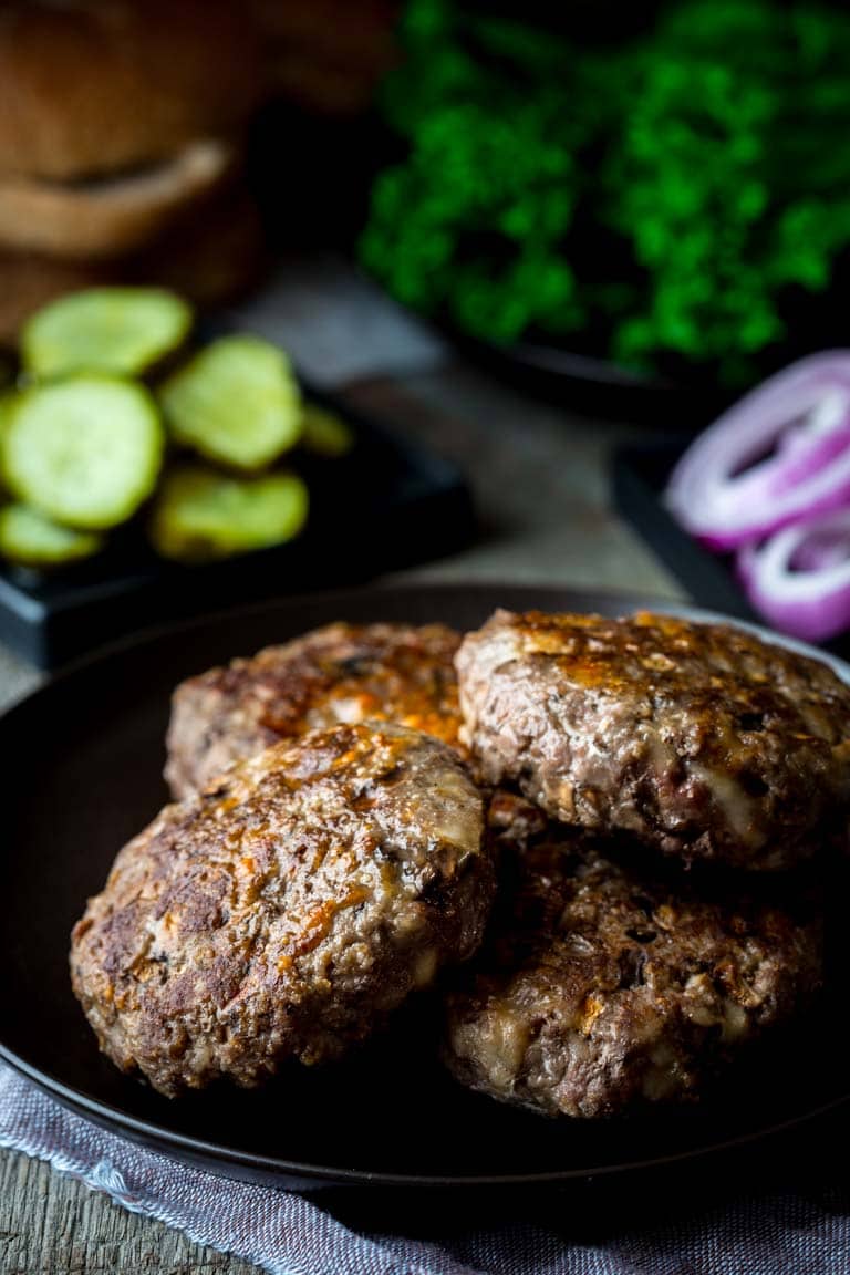 These Portobello and Swiss Beef Burgers are a healthier make-over of the all-American classic. And they’re ready in under 30 minutes, so you can get a delicious kid-friendly dinner on the table lickety-split! | Healthy Seasonal Recipes | Katie Webster