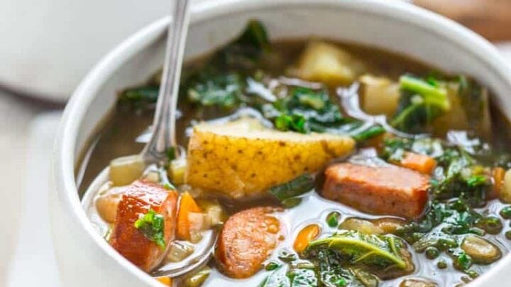white bowls with sausage and kale stew