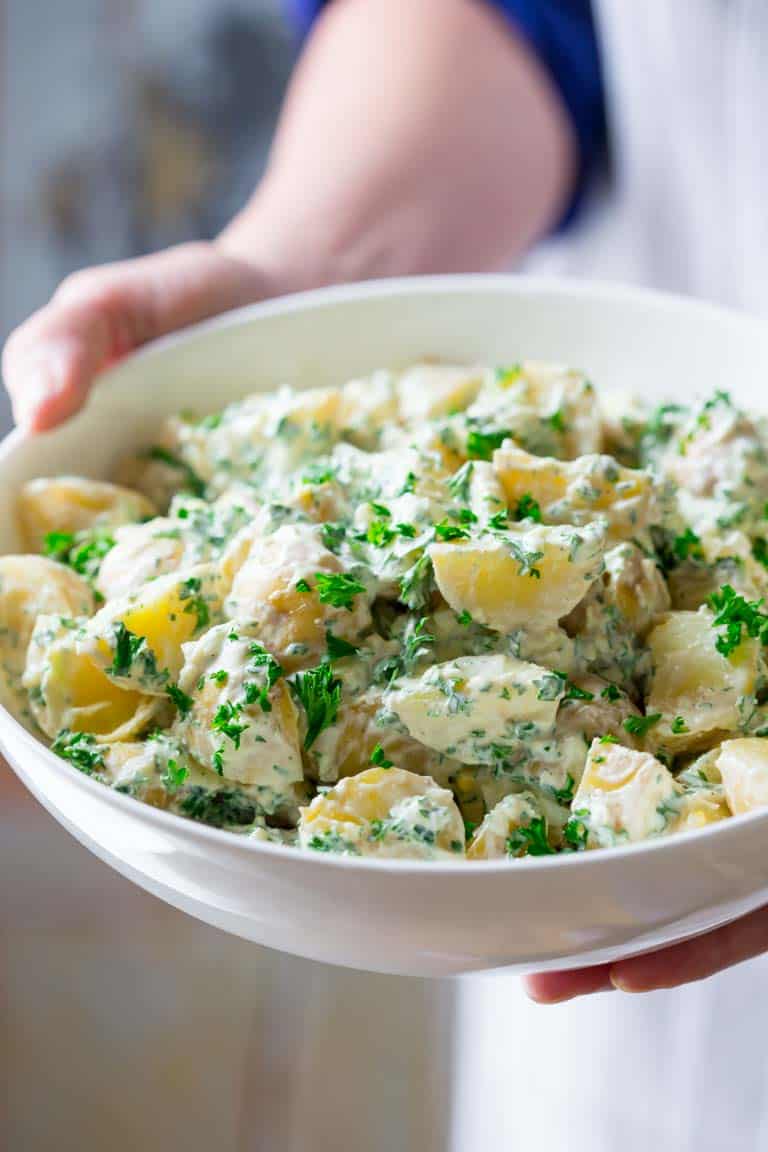 This Creamy Horseradish Potato Salad is a healthier twist on the classic Summer vegetarian side dish and it is mind blowing. It is so creamy and full of flavor that everyone will line up to get a bite! | Healthy Seasonal Recipes | Katie Webster