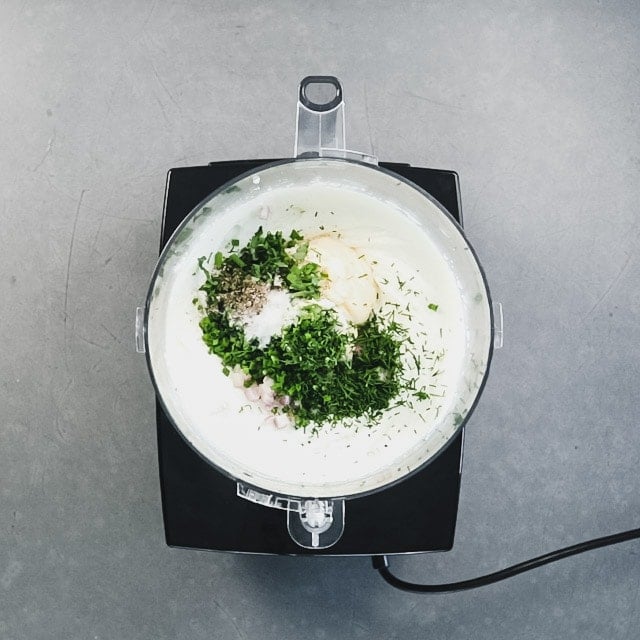 the herbs and seasoning in the food processor with the pureed cottage cheese