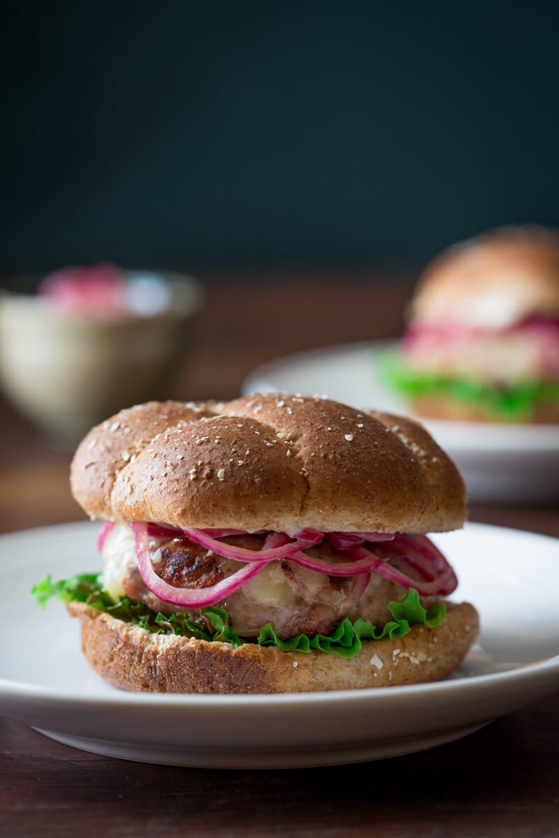turkey burger with pickled onions on top