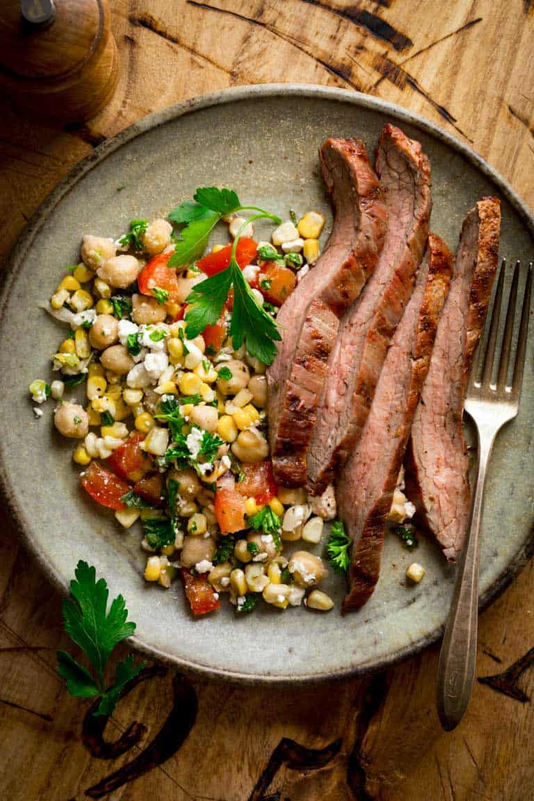 cajun flank steak from overhead on a ceramic plate