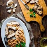 With this Garlic Herb Marinated Chicken recipe you will never have to eat bland dry grilled chicken again! Just 6 ingredients (including salt) and only 20 minutes of prep will give you a gluten-free, dairy-free and low-carb entree that literally sings with flavor. | Healthy Seasonal Recipes | Katie Webster