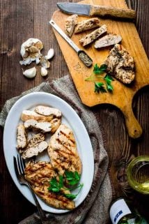 With this Garlic Herb Marinated Chicken recipe you will never have to eat bland dry grilled chicken again! Just 6 ingredients (including salt) and only 20 minutes of prep will give you a gluten-free, dairy-free and low-carb entree that literally sings with flavor. | Healthy Seasonal Recipes | Katie Webster
