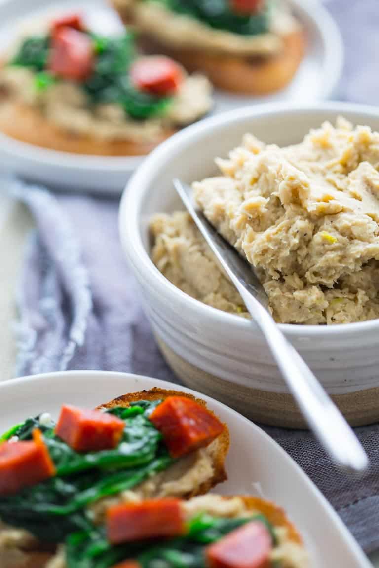 a close up of White Bean Bruschetta with Garlicky Greens
