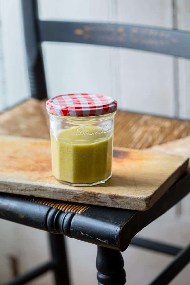 A jar of Caesar Salad dressing with a red and white cap