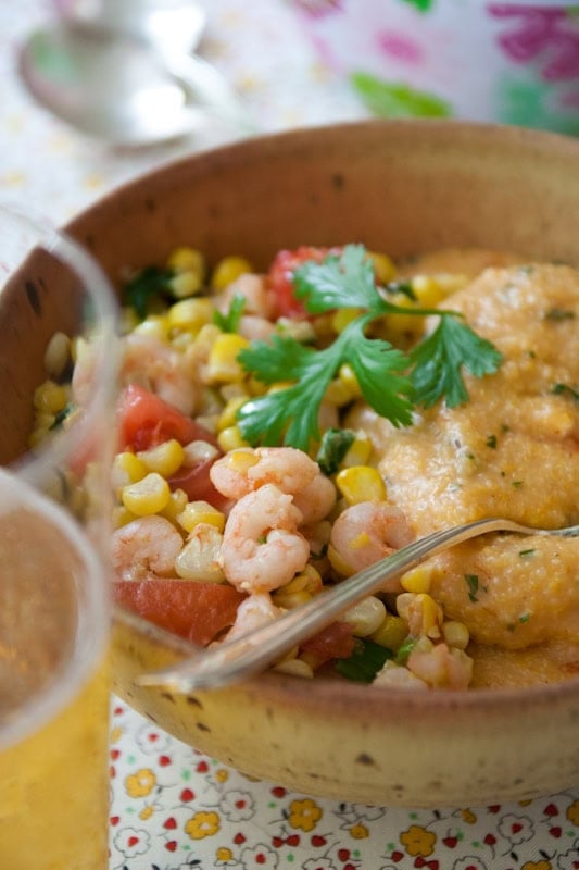 shrimp and corn with cheese grits the bowl of cheese grits with shrimp and corn saute on the side