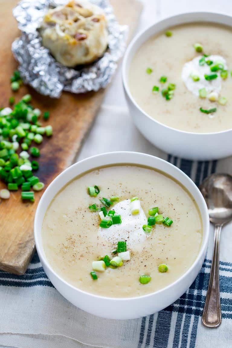 This Roasted Garlic Cheddar Soup will literally warm you up from the inside out! It is filled with yummy cheddar cheese and roasted garlic making it the perfect Winter comfort food and gluten free meal! | Healthy Seasonal Recipes | Katie Webster