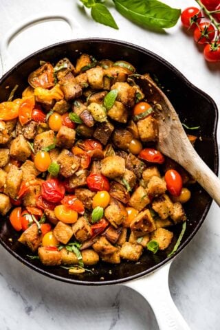 the skillet with the panzanella in it up close