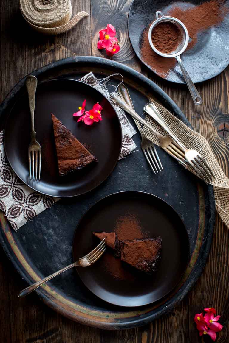 Flourless Chocolate Cake slices on black plates