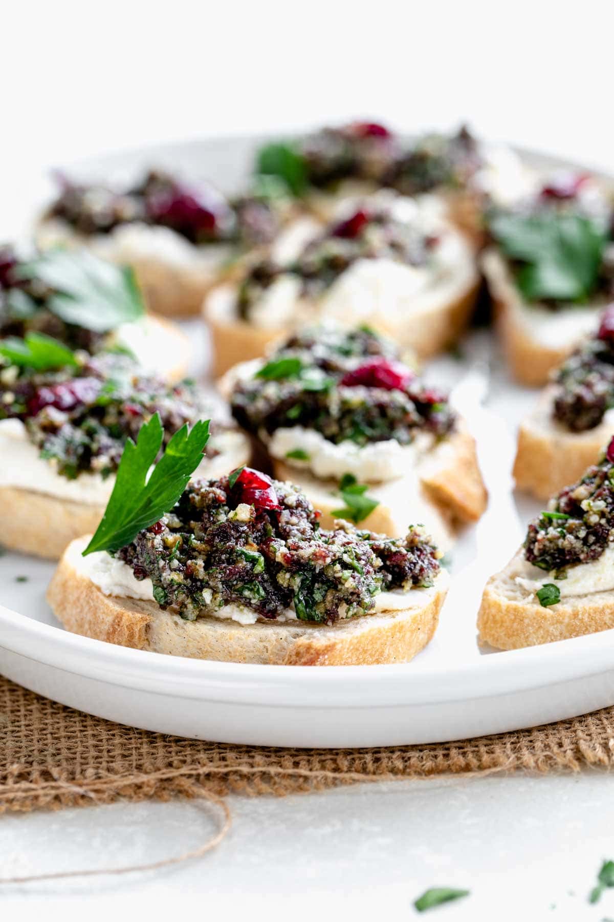 a platter of the cranberry pesto crostini