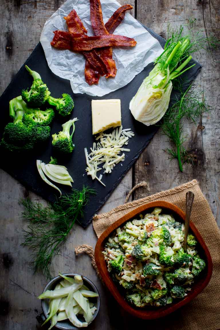 An overhead view of the ingredients and a bowl of broccoli salad.