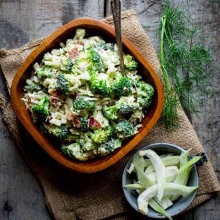 Broccoli salad from overhead with a dish of fennel next to it.