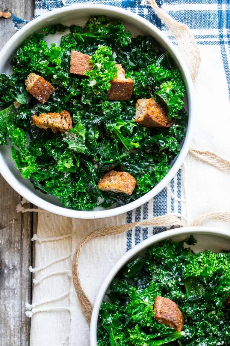 meal prep kale salad in two serving bowl
