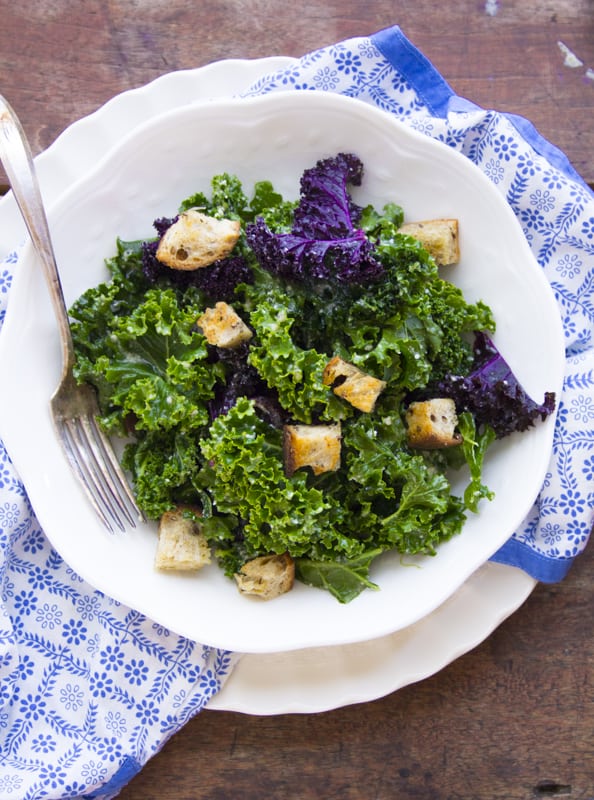 A plate of Kale with croutons and fork