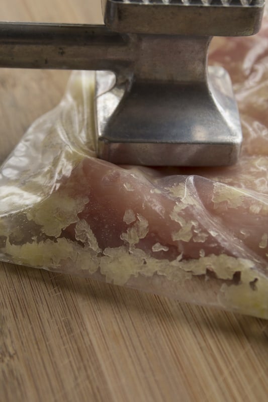 pounding the chicken in the bag