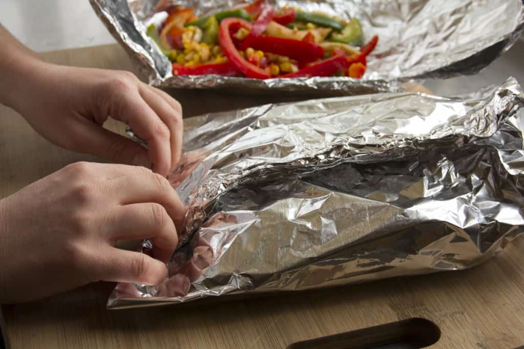 the fajita veggies on foil getting wrapped up