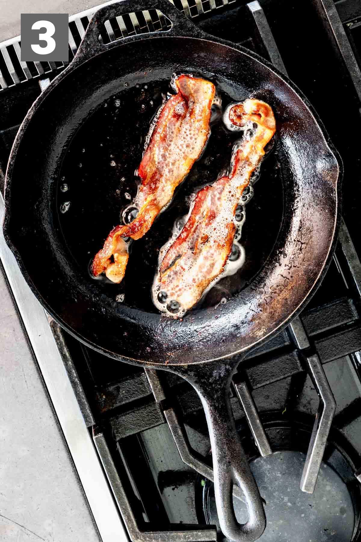 cooking the bacon in the skillet