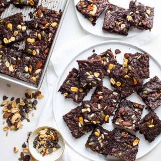 These Fudgy Greek Yogurt Trail Mix Brownies are the perfect treat to take to your next Spring event! Healthy Seasonal Recipes #brownie #vegetarian #dessert #chocolate #kidfriendly