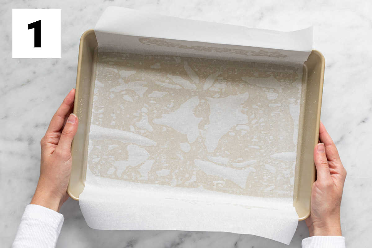 spray the pan with cooking spray, then layer parchment into the pan