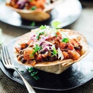 These Sweet potato and Black Bean Chili Burrito Bowls give you all the nutrition and yumminess from the veggie packed high fiber filling without needing a huge tortilla to wrap it all up.  It is vegetarian comfort food at it's best! | Healthy Seasonal Recipes | Katie Webster
