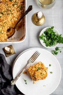 parsnip gratin on circular white plate with fork