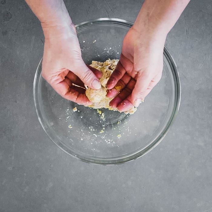 Knead the chicken mixture and form into 21 small meatballs
