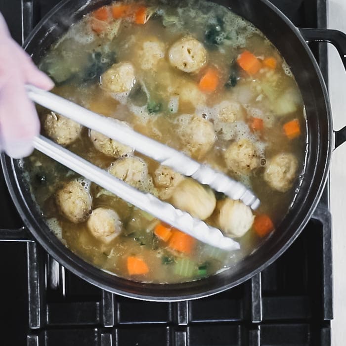 Add the baked meatballs to the soup.