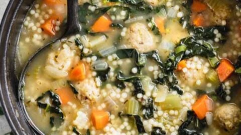 a black Dutch Oven filled with Wedding Soup