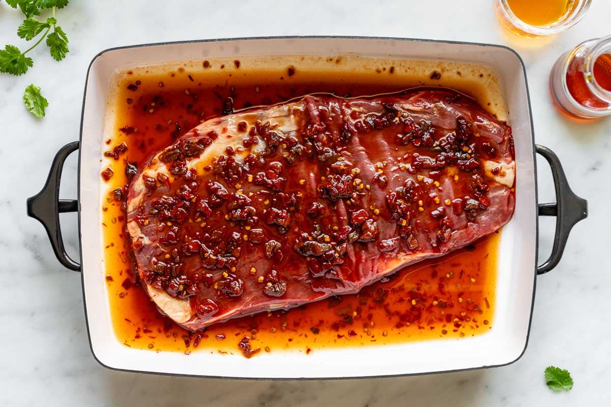 the steak in the chipotle marinade in a casserole dish