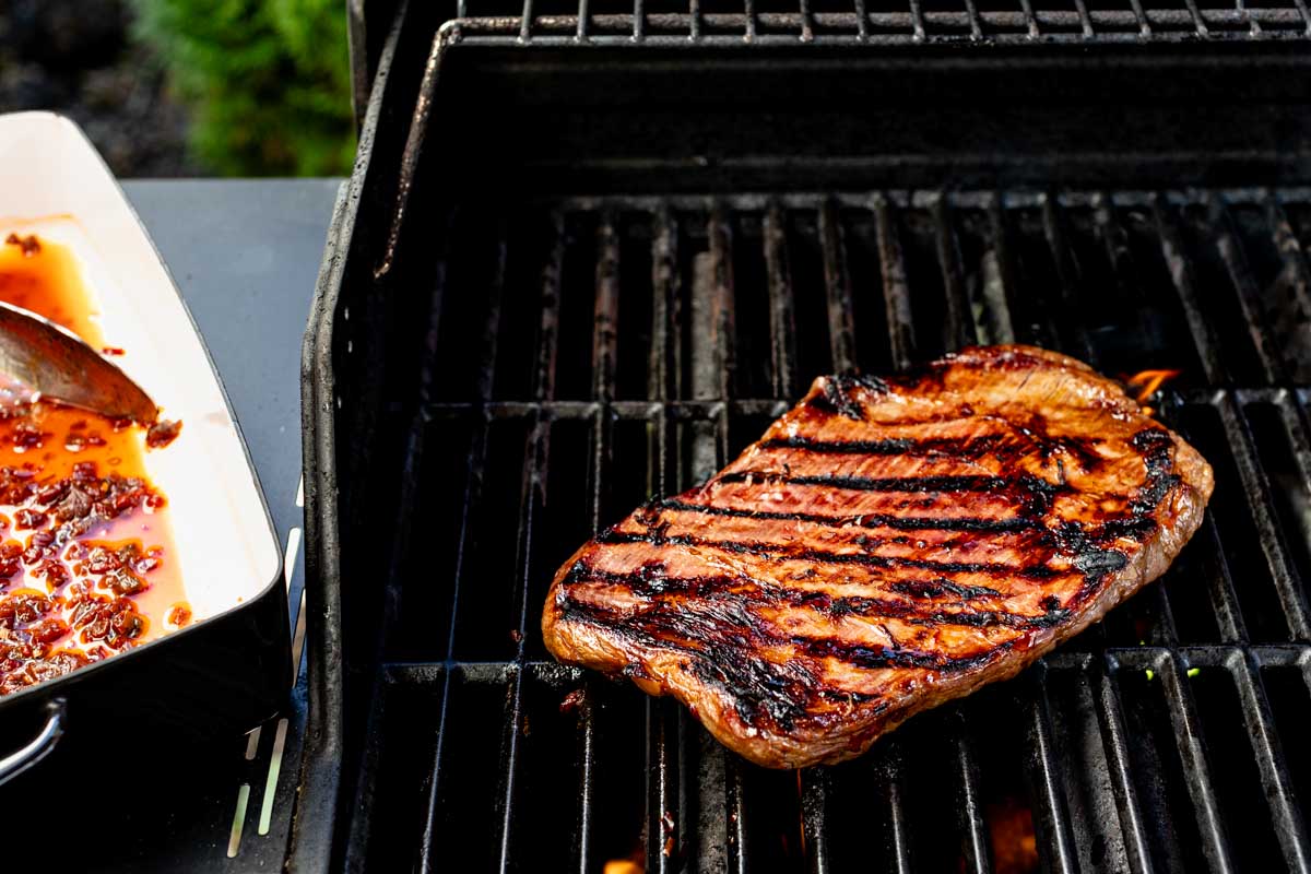 the steak on the grill
