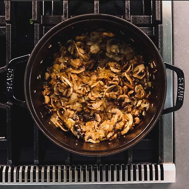 Add the mushrooms, salt, pepper and thyme and saute until the mushrooms are reduced down and most of the liquid is evaporated, about 5 to 7 minutes.