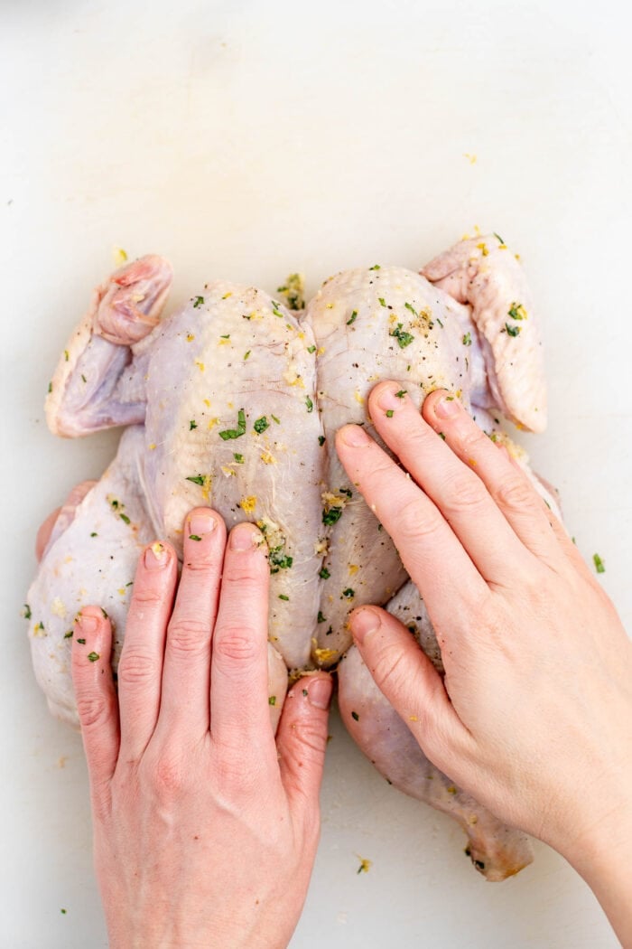 rub the garlic herb paste over the chicken