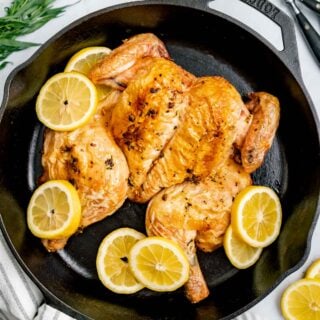 the spatchcocked chicken in the skillet