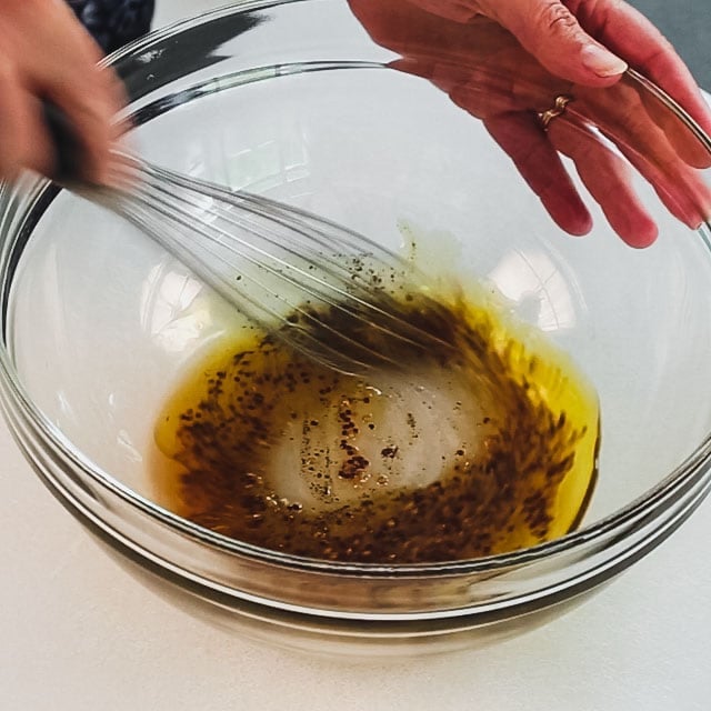 whisking the dressing