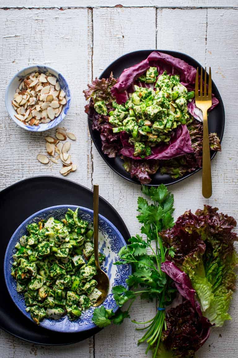 Chimichurri Chicken Salad in bowls alongside slivered almonds