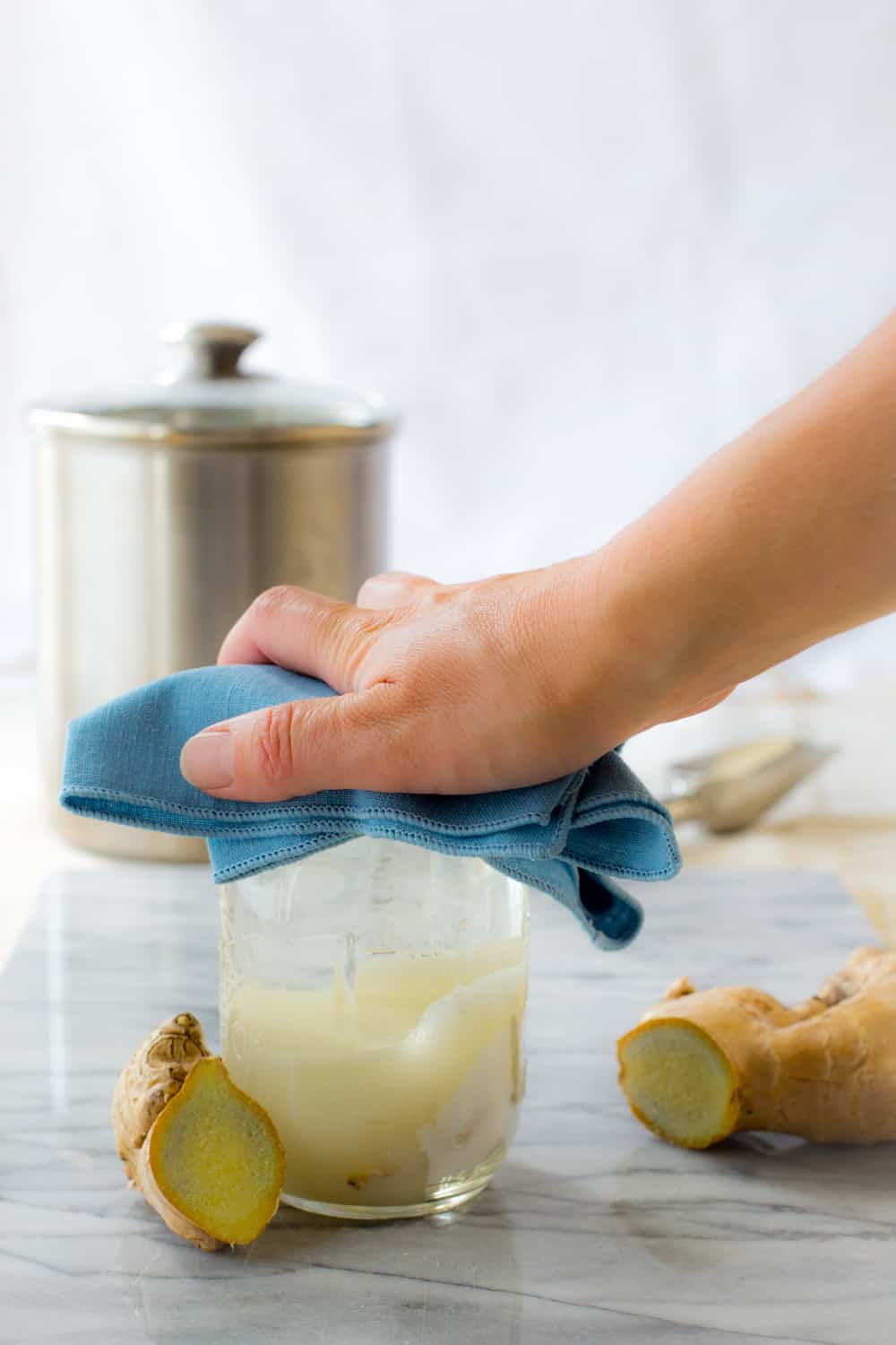 Shaking a jar or ginger simple syrup