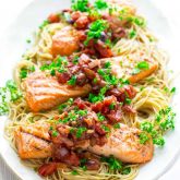 Healthy Grilled Salmon Puttanesca with Garlic tomato sauce with olives and capers. @healthyseasonal