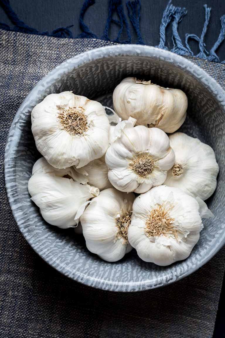 Garlic Lover's Roasted Garlic Caesar Salad, with roasted garlic in the dressing and a whole head of roasted garlic to go on each serving! The dressing is egg-free and it has capers in it!! | Healthy Seasonal Recipes | Katie Webster