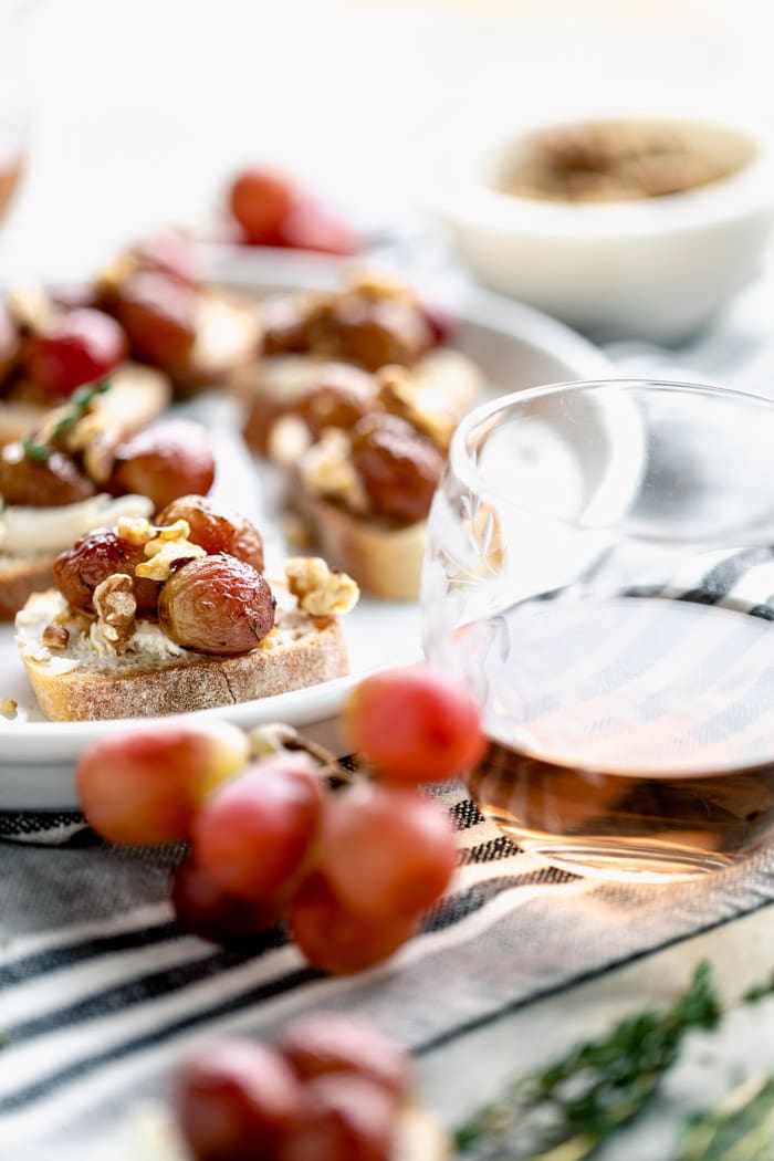 platter of appetizers with a glass of wine