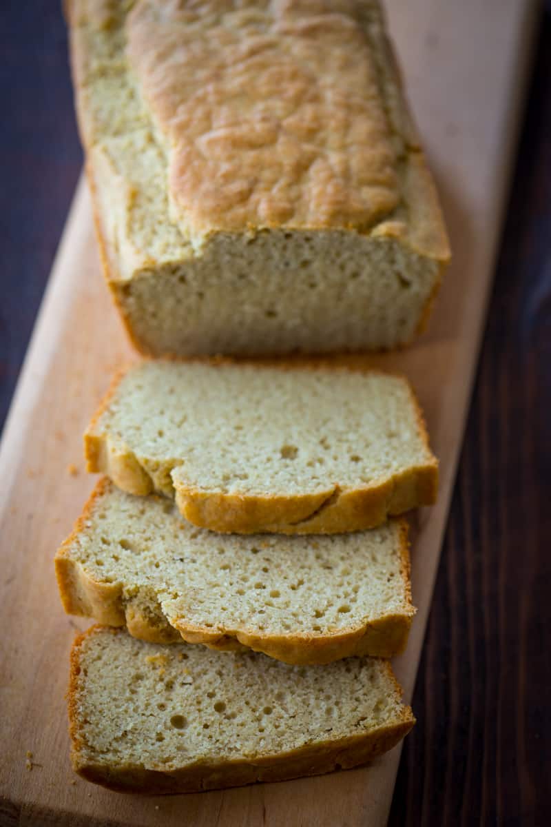 gluten free breakfast bread sliced on a cutting board