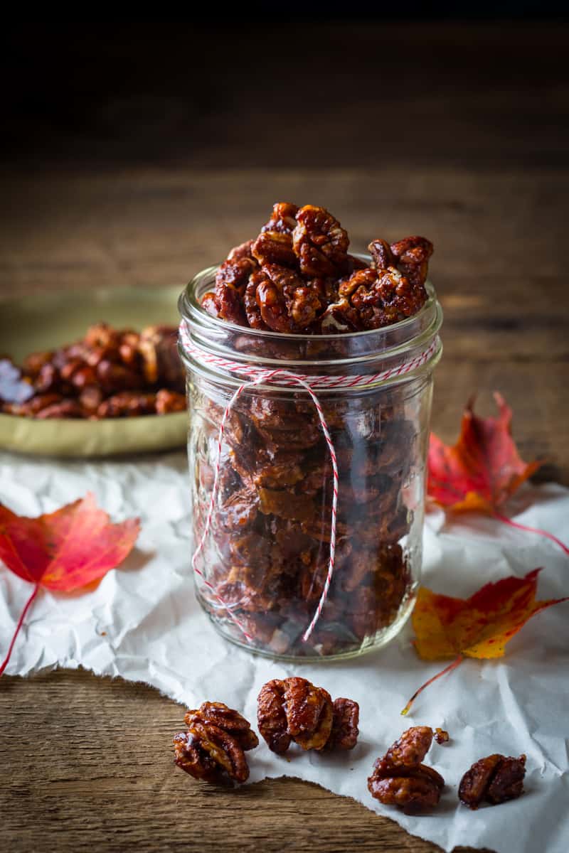 Chocolate Chili Spiced Pecans in a glass mason jar