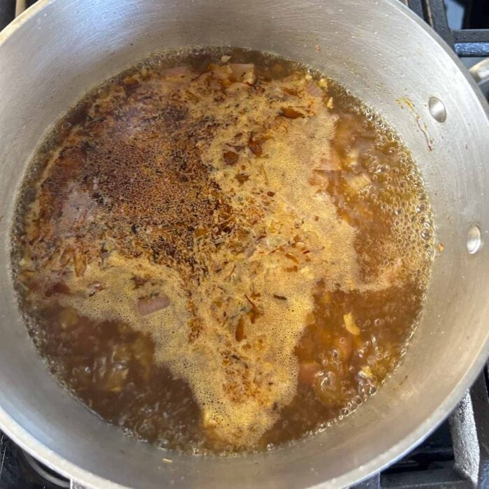 the broth coming to a simmer
