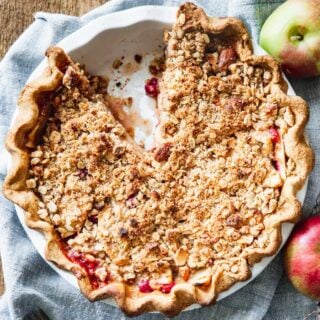 apple crumb pie overhead closeup with a slice taken away