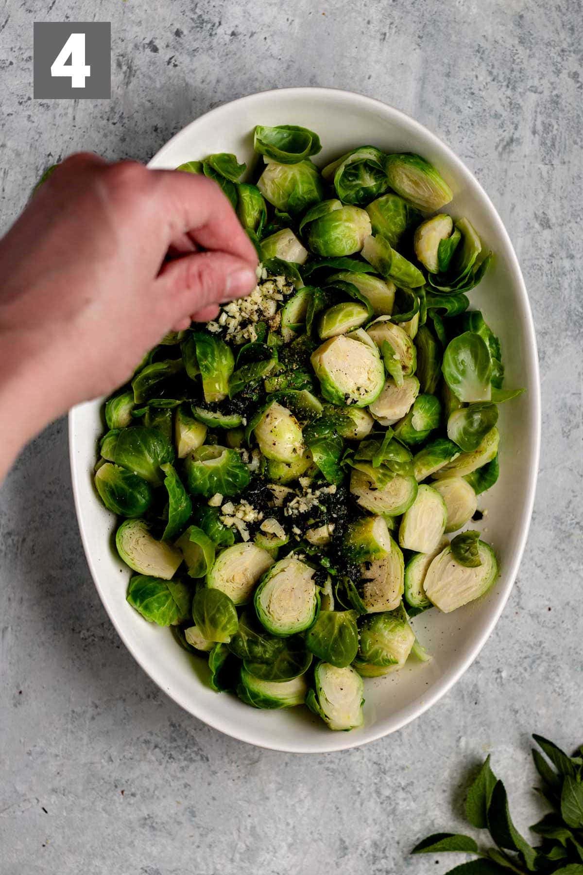 toss the cooked brussels with the garlic mixture and add on the nuts