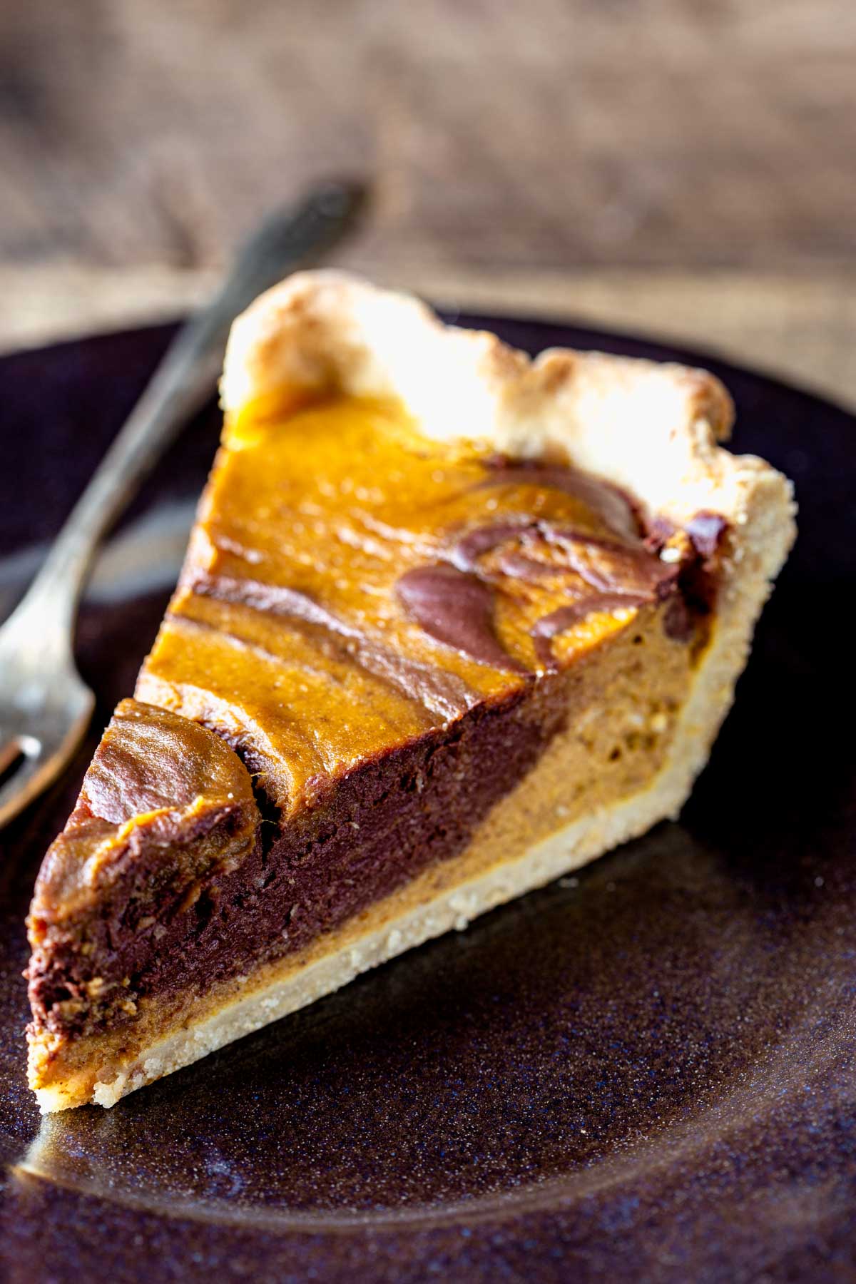 chocolate swirl pumpkin pie on a plate