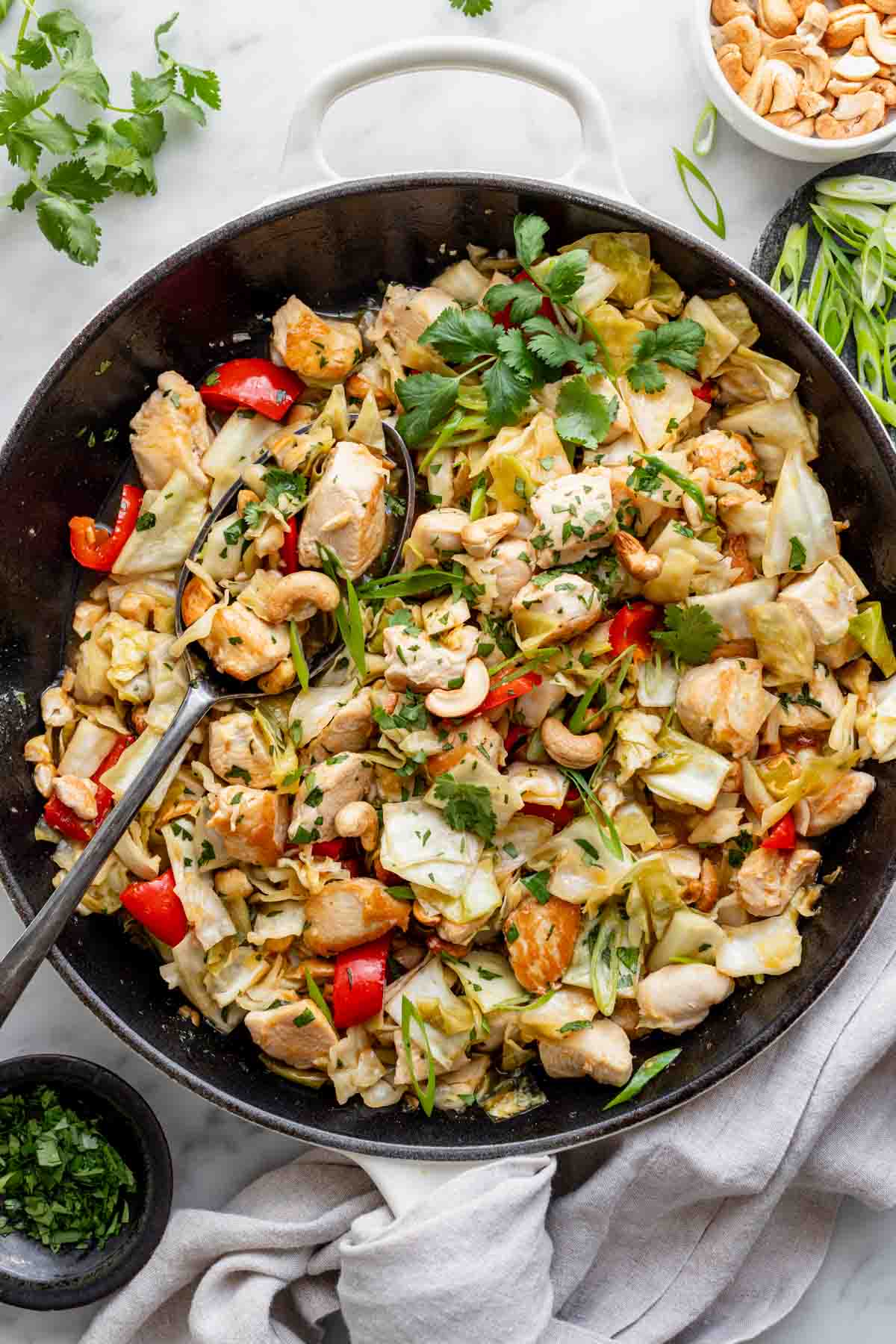 the skillet filled with cabbage chicken stirfry