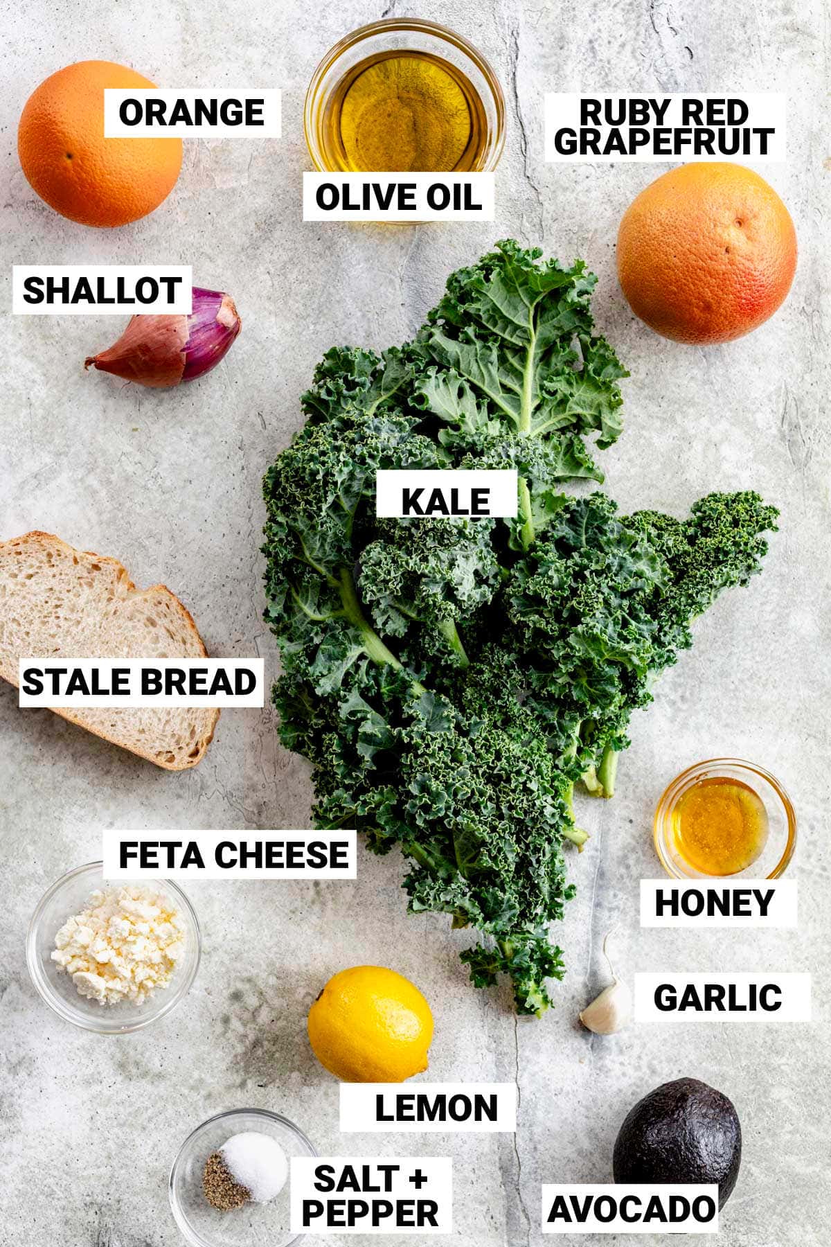 the kale, orange and other ingredients on a white table with text overlay